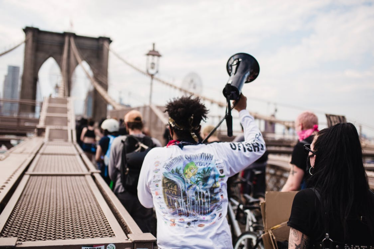 Black man holding a megaphone in a demonstration