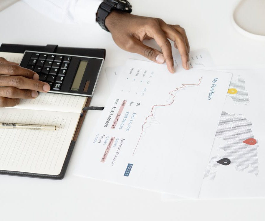 An individual calculating financial data